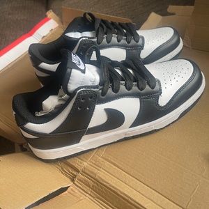 Nike Dunk Low Retro White Black Panda in Men’s Size 7 and Women’s Size 8.5